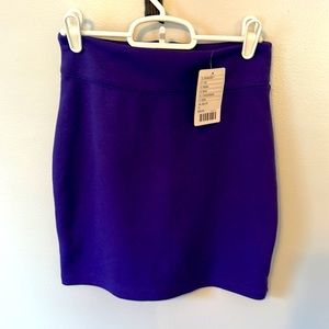 Fitted purple skirt size small. TAGS ON